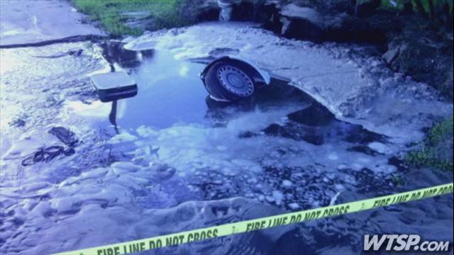 Large Sinkhole Swallows A Smart Car In Jacksonville Florida