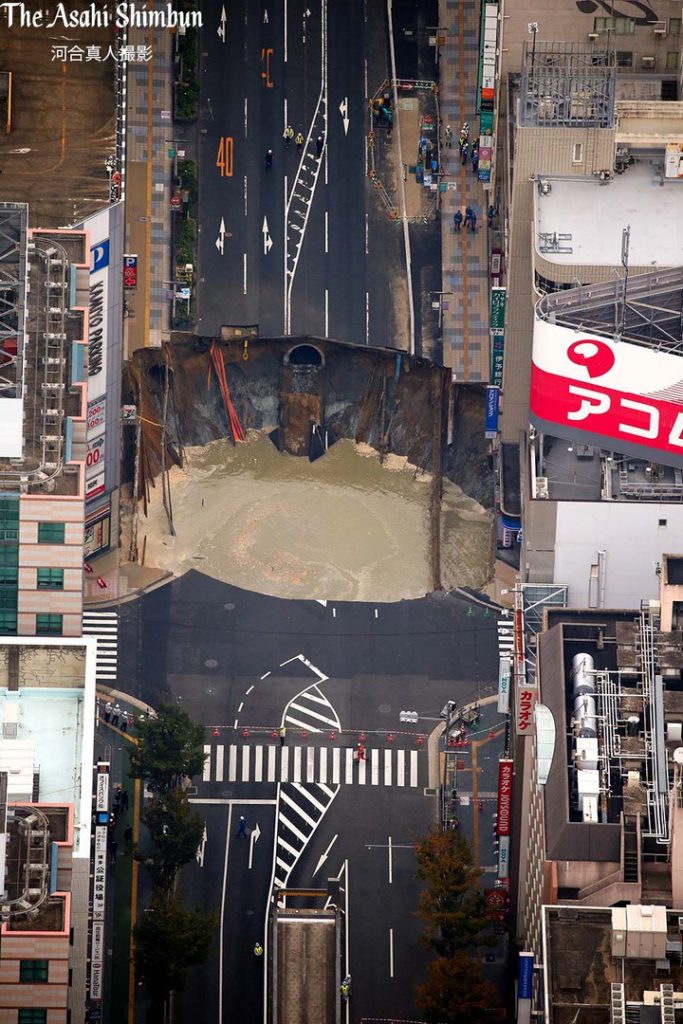 Huge Sinkhole Swallows Up Road In Fukuoka Japan In Pictures And Videos