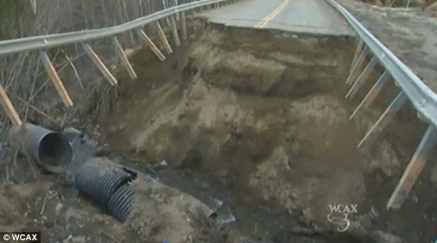 Shoddy work: Officials believe a quick rainstorm caused a flash flood, which was too violent for a 5-foot plastic culvert installed in the road to handle 