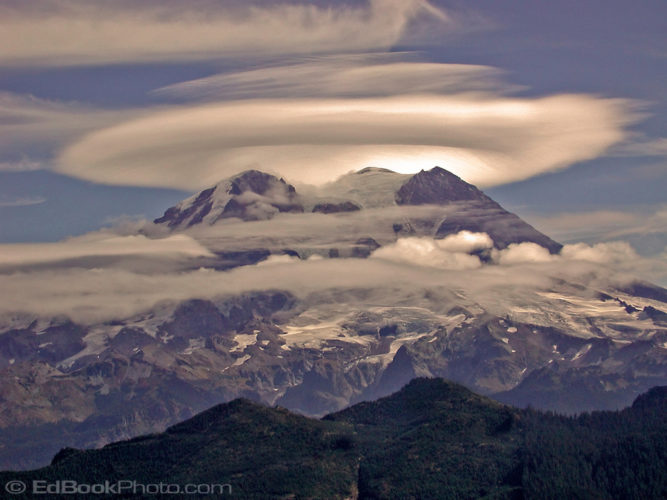 Mount Rainier lenticular cloud formation from the Puyallup Ridge, Mount Rainier from the Puyallup Ridge fire lookout west of the 14,410 ft volcano with a lenticular cloud over the mountain.