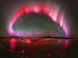 fantastic and rare red aurora over greenland and sweden