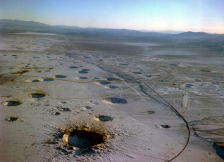 Nevada Test Site (NTS), Nevada nuclear test site craters, photo of Nevada nuclear test site craters, moonslandscape: Nevada nuclear test site craters, where did the usa conduct nuclear tests, where nuclear test bombs tested in US, Nevada Test Site (NTS) photo, discover Nevada Test Site (NTS), Nevada Test Site (NTS) nuclear tests site, nuclear test site in US, us nuclear tests site is Nevada test site, NTS nuclear test site in Nevada, photo of NTS, nevada test site photographs, discover nevada test site (nuclear test site) in images, images of Nevada test site, picture of Nevada test site, Neveada test site looks like a moon landscape, moonscape in Nevada, Nevada crater moonscape, Nevada Test Site (NTS) Moonscape. Photo: ESRI, The Nevada Test Site is the location where the United States conducting atomic testing, Earthquakes caused by underground nuclear explosions on Pahute Mesa, Nevada Test Site