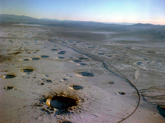 Nevada Test Site (NTS), Nevada nuclear test site craters, photo of Nevada nuclear test site craters, moonslandscape: Nevada nuclear test site craters, where did the usa conduct nuclear tests, where nuclear test bombs tested in US, Nevada Test Site (NTS) photo, discover Nevada Test Site (NTS), Nevada Test Site (NTS) nuclear tests site, nuclear test site in US, us nuclear tests site is Nevada test site, NTS nuclear test site in Nevada, photo of NTS, nevada test site photographs, discover nevada test site (nuclear test site) in images, images of Nevada test site, picture of Nevada test site, Neveada test site looks like a moon landscape, moonscape in Nevada, Nevada crater moonscape, Nevada Test Site (NTS) Moonscape. Photo: ESRI, The Nevada Test Site is the location where the United States conducting atomic testing, Earthquakes caused by underground nuclear explosions on Pahute Mesa, Nevada Test Site