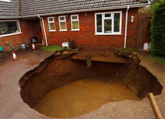 sinkhole, sinkhole photo, amazing sinkhole, sinkhole uk 2014, sinkhole photo, photo of sinkholes, largest sinkholes around the world, photo of sinkhole around the world, sinkhole photography, sinkhole picture, sinkhole compilation, sinkhole , sinkhole in the driveway of a house in Walter's Ash, Buckinghamshire. Picture: Reuters