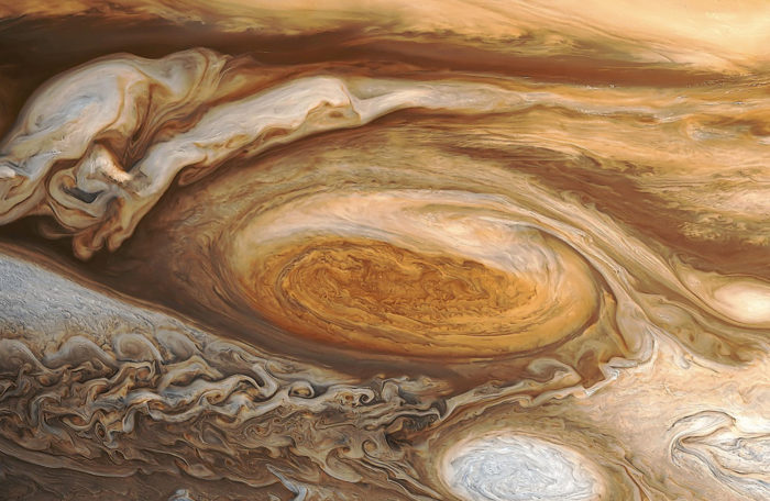 jupiter storm, largest storm in solar system, jupiter cyclone, The Great Red Spot shot by Voyager 1 in 1979 reveals a huge hurricane-like storm in Jupiter’s southern hemisphere. Photo: NASA, amazing spece weather: jupiter's storm, strange space weather: Jupiter cyclone, Deadliest Space Weather  - Biggest Storm in the Solar System, Deadliest Space Weather, Biggest Storm in the Solar System