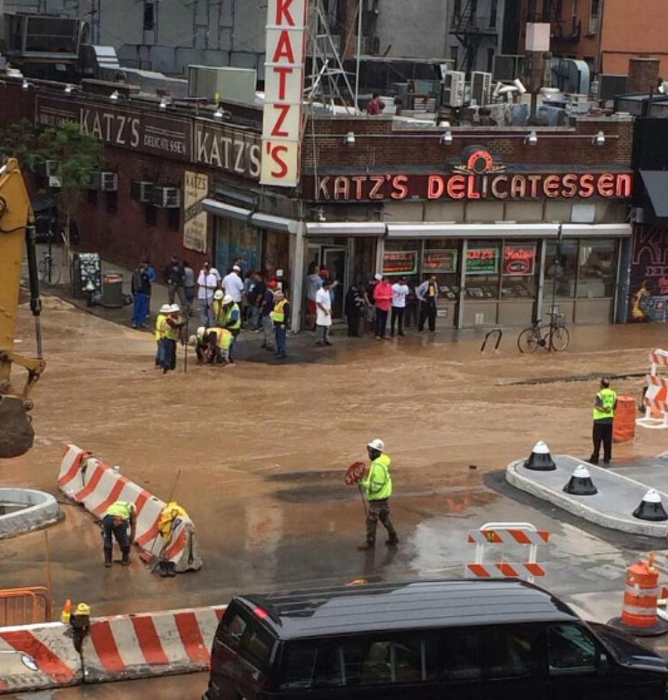Katz's Delikatessen floods may 2014, sinkhole and floods at Katz's Deli, Katz's Deli sinkhole and flooding may 22 2014, Flooding in front of Katz's Delikatessen in New York after watermain break on May 22, 2014. Photo by MARCUS SANTOS/NEW YORK DAILY NEWS