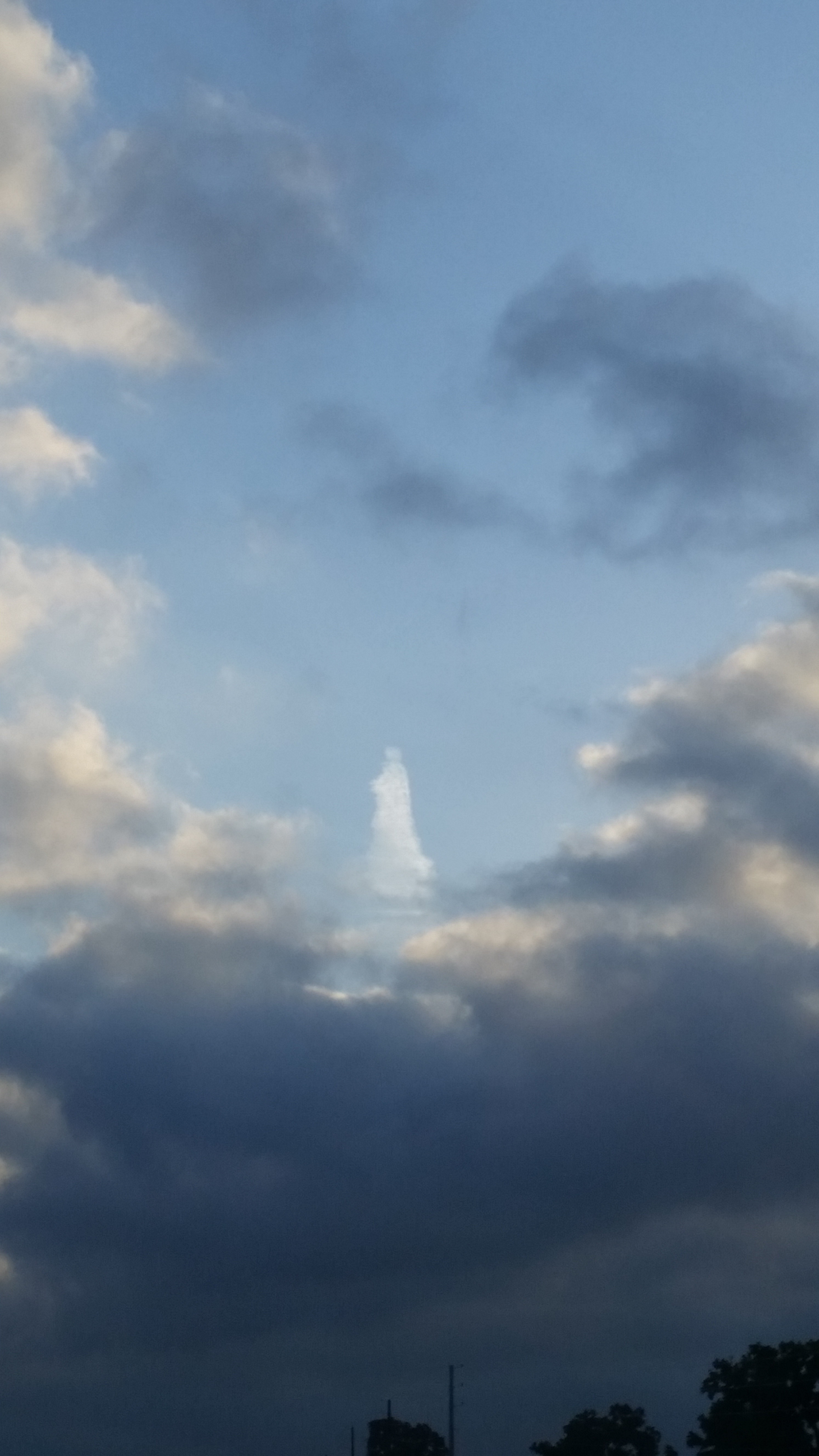 jesus cloud, jesus in the sky, jesus in the clouds, cloud ressembling jesus, cloud shaped like jesus,, Divine apparition? Jesus in a cloak spotted over Madisonville in Texas . Photo: Britney Gibbs, is this jesus in the clouds: Madisonville woman spots Jesus in the clouds over Texas may 2014, jesus cloud texas may 2014 photo, strange cloud form: jesus in the sky, this strange cloud represents jesus in Texas may 2014 photo, Divine apparition?Jesus in a cloak spotted over Madissonville in Texas . Photo: Britney Gibbs