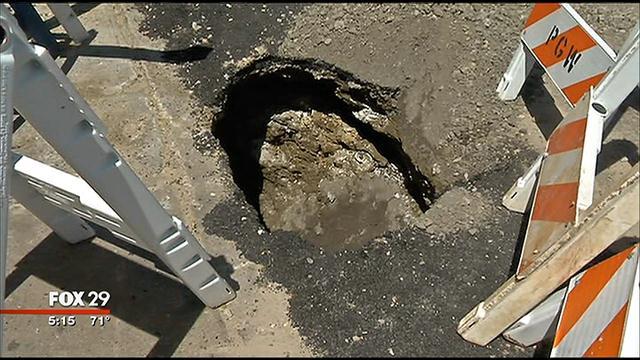Philadelphia pizzeria sinkhole - Fox 29, Philadelphia pizzeria sinkhole: This small pothole is part of larger hole going under the walk and probably further - Fox 29