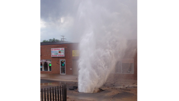Water Main Break Sends Gallons Gushing Into Air, geyser, geyser aurora, geyser aurora june 2014, water main break, water main break auror june 2014, sinkhole, sinkhole june 2014, sinkhole aurora june 2014, This amazing geyser erupted from a stree in Aurora after a water main break created a sinkhole on June 26 2014. Photo:  Martha Diera, A water main break sent thousands of gallons of water through the pavement and into the air in Aurora Thursday afternoon, amazing geyser in Aurora june 2014, geyser erupts in aurora after water main break, water main break creates sinkhole and geyser in aurora, geyser eruption aurora june 2014, water main break geyser eruption june 2014 aurora, water main break geyser aurora june 2014, strange geyser eruption in aurora june 2014