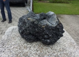 This 20-inches diameter stone landed This chunk landed on the forecourt of a house. Stones were still warm even hours after the explosion. Photo: Pesse
