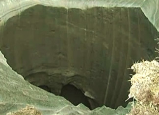 new video of mysterious giant hole in yamal by scientists, new video yamal hole by scientists, This close-up image of the mysterious crater discovered in the Yamal Peninsula is from a new footage filmed by a scientific expedition sampling the undefined sinkhole. Photo: Youtube video, new video yamal crater, yamal crater new close-up video, scientists sample mysterious yamal crater, yamal sinkhole scientist sampling, on-site video of yamal peninsula giant hole in the ground, New On-Site Video Of Mysterious Giant Crater in Yamal Baffles Scientists, New video of mysterious giant Siberian hole filmed by investigation team, Mysterious giant hole suddenly appears in Siberia, A mysterious giant hole and crater have suddenly appeared in Siberia, Causes of this mysterious crater found in the Yamal Peninsula are still unknown even with this new close-up video!