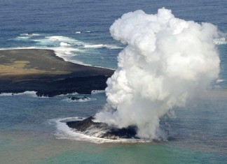 New volcanic island off Japan coast Niijima, Geological oddity: Smoke from an erupting undersea volcano forms a new island off the coast of Nishinoshima in the southern Ogasawara chain of islands.