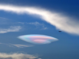Lenticular clouds, Lenticular clouds look like UFO spaceships, lenticular cloud ufo, clouds look like ufos, ufo clouds, lenticular clouds, fire rainbow clouds, iridescent ufo-shaped cloud, multicolor ufo-shaped lenticular cloud over china, photo iridescent lenticular cloud, photo iridescent ufo-shaped lenticular clouds over china, fire rainbow lenticular clouds china july 2014, Have you ever seen that: A giant iridescent lenticular clouds? It appeared over China on August 4 2014