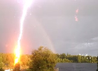 lightning, lightning video, best lightning video, amazing lightning video, terrfying lightning video, awesome lightning video, Flash? Lightning Almost Strikes Woman Filming A Rainbow in Sweden (VIDEO)