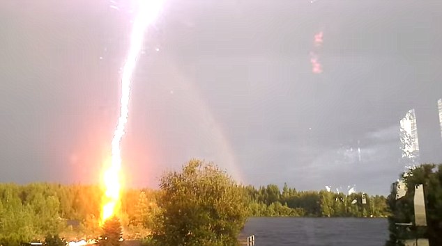 lightning, lightning video, best lightning video, amazing lightning video, terrfying lightning video, awesome lightning video, Flash? Lightning Almost Strikes Woman Filming A Rainbow in Sweden (VIDEO)