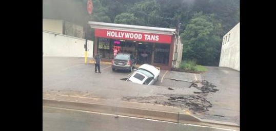 OMG! My car is being swallowed by a sinkhole at Ross Township. Photo: Twitter, Ross Township sinkhole, ross sinkhole, sinkhole swallows car Ross Township, sinkhole car Ross Township, car swallowed by sinkhole in Ross Township pa, ross sinkhole swallows car august 2014, sinkhole car ross township august 2014, The car is being swallowed by a huge sinkhole in Ross Township, Pa on August 12 2014.