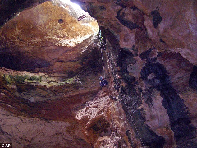 wyoming sinkhole natural trap cave archeological discovery, The entrance of Natural trap cave in Wyoming. Photo: Daily Mail, Natural trap cave, natural trap cave archeology, natural trap cave ice age archeology, natural trap cave fossils and bones archeology, Natural trap cave sinkhole, Natural trap cave sinkhole wyoming, Natural trap cave sign in Wyoming, Ancient Fossils Discovered At Natural Trap Cave - Wyoming Sinkhole Hidden Archeological Treasures, Wyoming Natural Trap Cave amazing Archeological Treasures, Natural trap cave, natural trap cave archeology, natural trap cave ice age archeology, natural trap cave fossils and bones archeology, Natural trap cave sinkhole, Natural trap cave sinkhole wyoming, Natural trap cave sign in Wyoming, The natural trap cave (Wyoming) contains amazing archeological treasures from last ice age such as bones and fossils of mamooths and american lions. VIDEO, archeology, mystery places, wyoming sinkhole, natural trp cave, ancient fossils, archeological treasures, video
