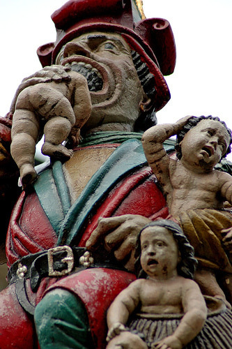 This nearly 500 year old sculpture called the Kindlifresser or child eater depicts an ogre eating a sack of babies and no one is sure why!, Child Eater, Child Eater fountain, Kindlifresserbrunnen, Kindlifresser, Child Eater, Kindlifresser or the child eater fontain in Bern. Terrifying!, terrifying fountain bern switzerland, chindlifresser or child eater fountain bern, This terrifying sculpture called Kindlifresserbrunnen or child eater fountain is erected in the old town of Bern, Switzerland