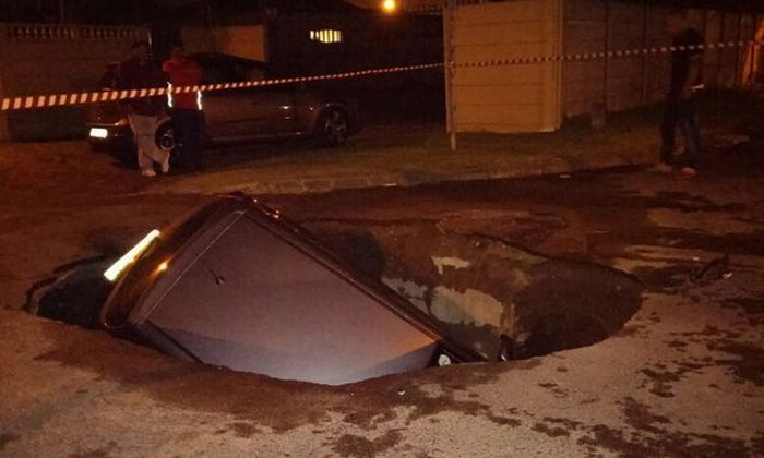 car swallowed by sinkhole in Cape town november 1 2014, sinkhole cape town november 2014, sinkhole swallows car cape town, sinkhole swallows car cape town photo, sinkhole car cape town november 2014, sinkhole cape town swallows car november 1 2014