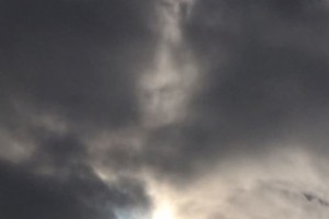 mystery face cloud, face in cloud during solar eclipse march 2015, face in cloud video, march 2015 solar eclipse face in cloud, face in clouds video, face in clouds photo, Solar Eclipse: Woman captures mystery face in cloud after taking picture of phenomenon