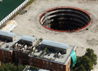 deep hole chicago spire, spire giant hole chicago,