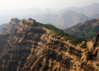 Deccan Traps volcanism dinosaur extinction, asteroid dinosaur extinction, dinosaur extinction theories, dinosaur extinction theory, volcanism and asteroid dinosaur extinction, Photograph of part of the main stack of 66 million year old Deccan Traps lava flows near the city of Mahabaleshwar, India. The entire volume of the Deccan Traps could have covered an area as large as the state of California in a mile deep pile of lava flows.(Mark Richards photo)