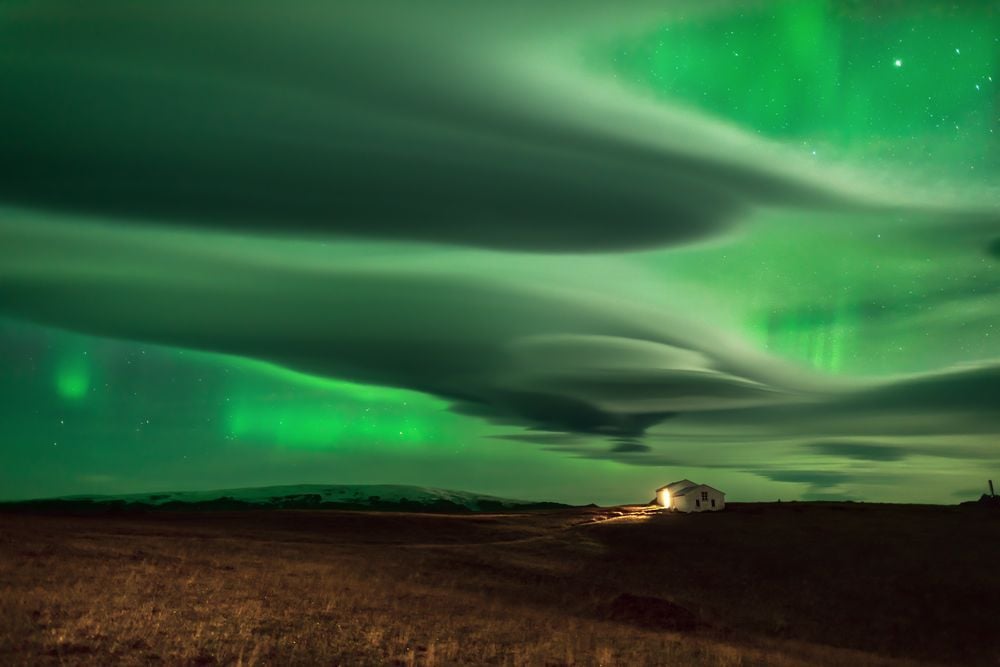 aurora lenticular clouds, lenticular clouds colored green by northern lights, auror color lenticular clouds green, green lenticular clouds due to aurora in iceland, lenticular clouds northern lights green