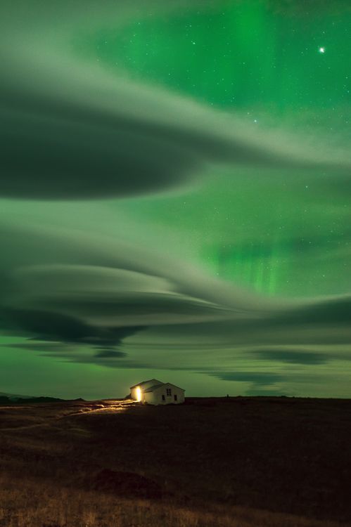 aurora lenticular clouds, lenticular clouds colored green by northern lights, auror color lenticular clouds green, green lenticular clouds due to aurora in iceland, lenticular clouds northern lights green, Awesome lenticular clouds captured at sunset over Iceland