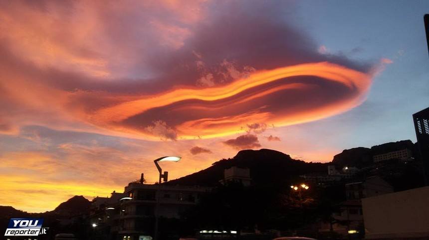 lenticular clouds italy, lenticular clouds lotejanni italy, lenticular clouds etna italy, sky on fire, lenticular cloud picture, This fiery lenticular cloud formed in the sunset sky of Italy on November 21 2015, As if the lenticular cloud was about to swallow up Mount Etna.