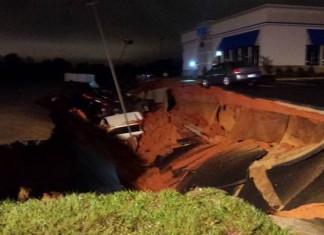 sinkhole swallows 15 cars mississippi, sinkhole swallows 15 cars meridian mississippi, sinkhole swallows 15 cars meridian mississippi pictures, sinkhole swallows 15 cars meridian mississippi videos, giant sinkhole mississippi november 7 2015, mysterious sinkhole meridian mississippi november 7 2015, meridian mississippi sinkhole, sinkhole meridian mississippi nov 2015, A view into the giant sinkhole that opened up in Meridian Mississippi on November 7 2015