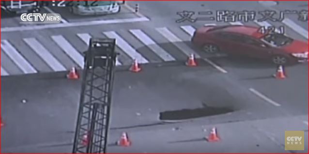 road collapse giant sinkhole china cctv video, sinkhole cctv video, sinkhole video china, sinkhole forms in front of cameras in china, china sinkhole april 2016 video