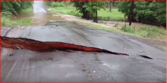 road cracks texas floods, road collapse floods texas, road cracks collapse texas floods