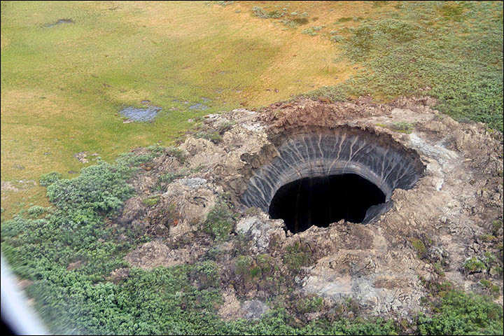 big bang form mysterious crater siberia, big bang crater siberia loud boom, big bang theory mysterious crater siberia, loud boom mysterious crater siberia formation, big bang and sky glow create siberian crater, Siberia's mystery end of the world crater formed after massive explosion heard 100km away, Enormous 'big bang' that caused a 'glow in the sky' created 230ft mystery crater, Big bang formed crater causing 'glow in sky': explosion was heard 100 km away