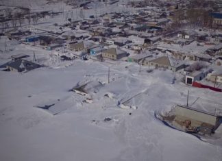snow blizzard Kazakhstan, snow blizzard Kazakhstan february 2017, snow covers houses in Kazakhstan, people build snow tunnels to get out of their homes in Kazakhstan, huge amount of snow Kazakhstan video and pictures