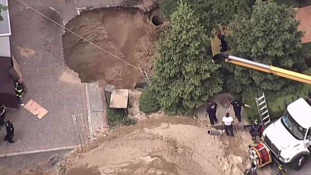 Gigantic Sinkhole Swallows Man Alive After Cesspool Collapse in Long Island Yard, huntington giant sinkhole cesspool, huntington sinkhole, huntington sinkhole video