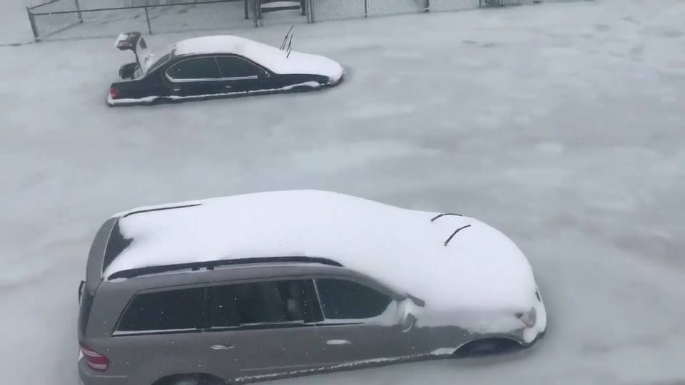 flooding massachusetts, bomb cyclone floos massachusetts freeze, cars trapped in ice after flooding waters freeze in Severe, Massachusetts, Storm surge freezes in Severe, MA, trapping hundreds of cars in ice