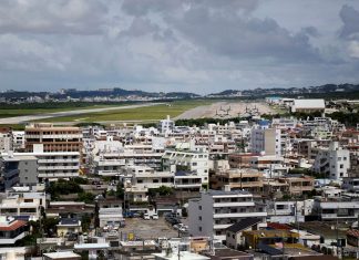 A view of Marine Corps Air Station Futenma, which is next to a residential area and has been at the center of controversy in Okinawa over claims of water contamination, okinawa water contamination pfas, drinking water contamination us army okinawa japan