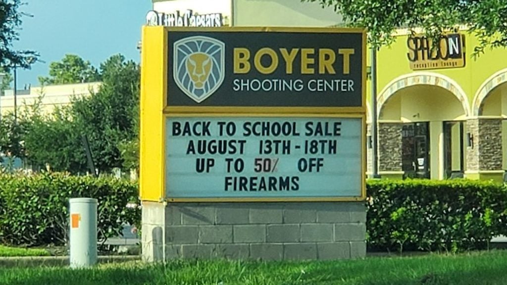 Back to school sale sign  for firearms company in Texas