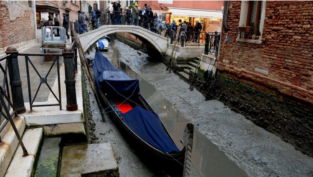 Venice canals almost run dry of water during unusually low tides just