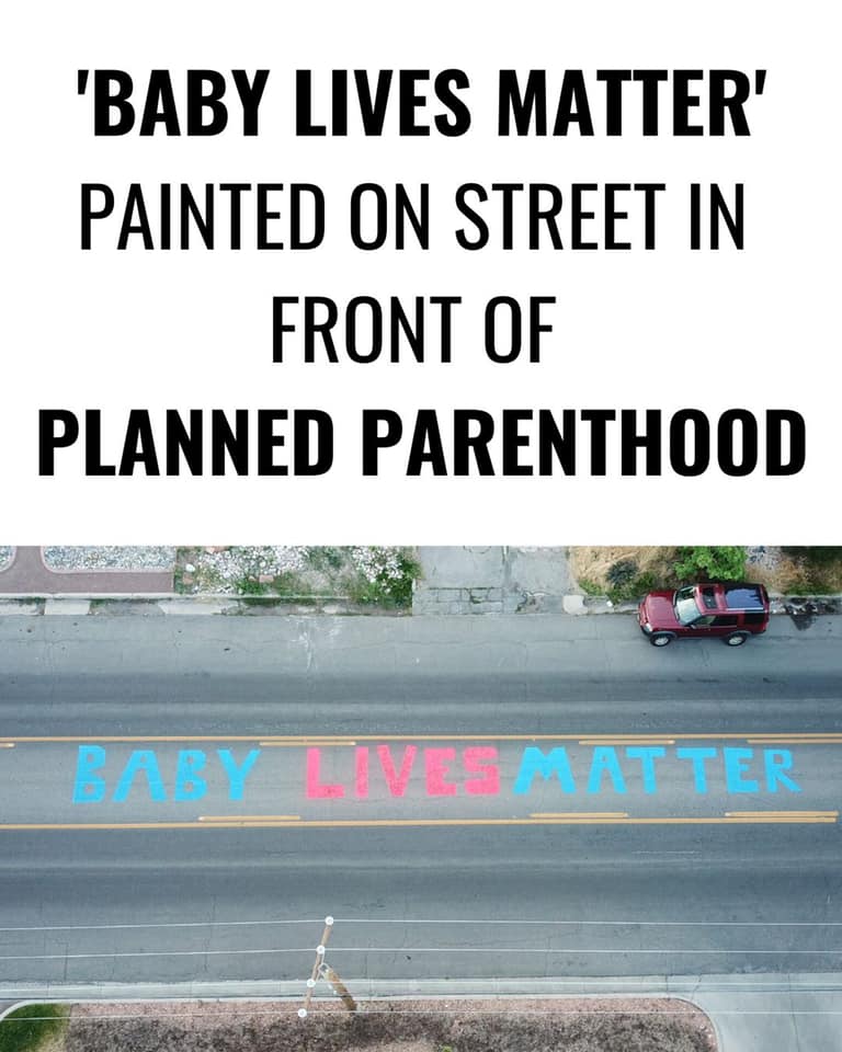 Baby lives matter painted on street in front of planned parenthood in Salt Lake City