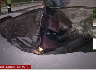 Driver crashes his truck into massive sinkhole in St. Louis, giant sinkhole truck st louis