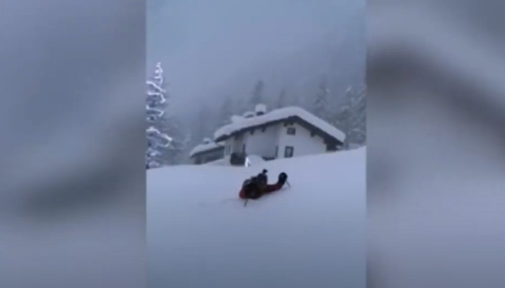 Think snow is deep near you Italian has to wade through FIVE-FEET high snow to leave his house