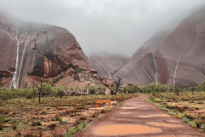 uluru waterfalls, uluru waterfalls video, uluru waterfalls pictures, Waterfalls cascade down Uluru as severe weather brings heavy rain to Nothern Territory in Australia