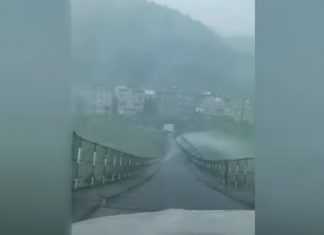 Terrifying scene as cable bridge violently swings as strong winds batter southern China, Terrifying scene as cable bridge violently swings as strong winds batter southern China video, Terrifying scene as cable bridge violently swings as strong winds batter southern China footage, Terrifying scene as cable bridge violently swings as strong winds batter southern China may 2021