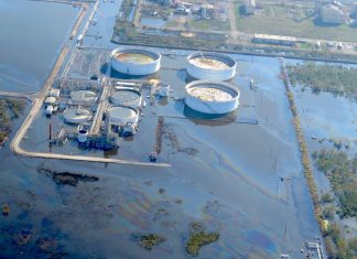 large oily sheen in the floodwaters surrounding part of the Alliance Refinery near Belle Chasse. The refinery flooded just after Hurricane Ida struck the Louisiana coast.