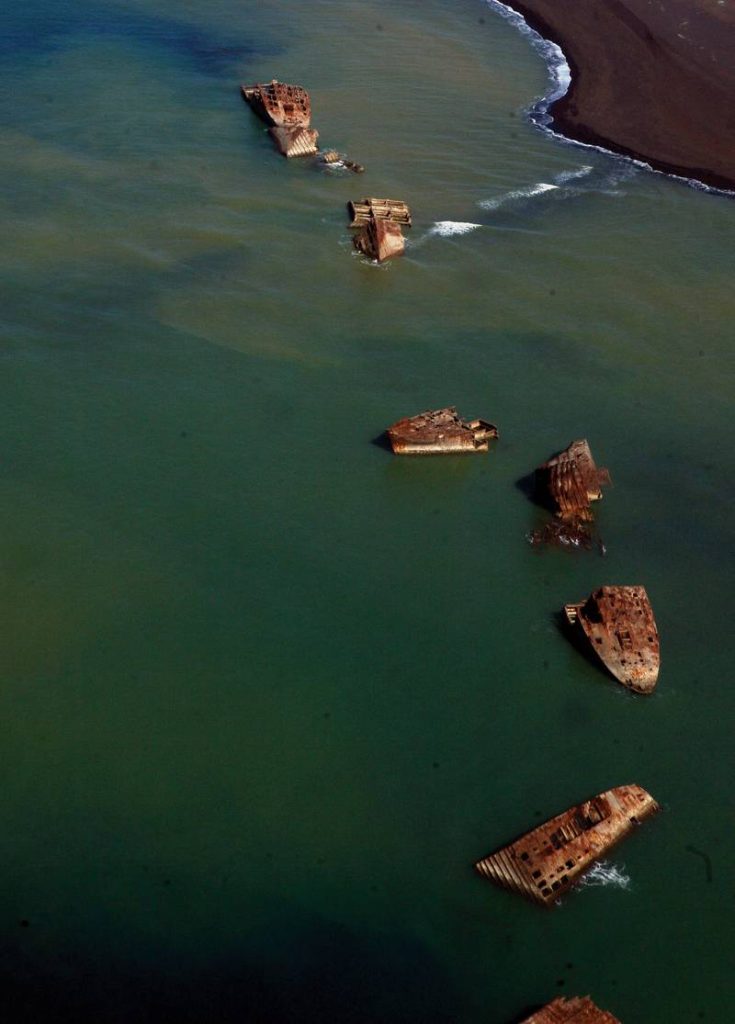 The black beach on Iwo To, formerly known as Iwo Jima, was stormed by thousands of U.S. Marines Feb. 19, 1945 during the Battle of Iwo Jima. Many relics of the war remain in the waters and scattered among the sands.
