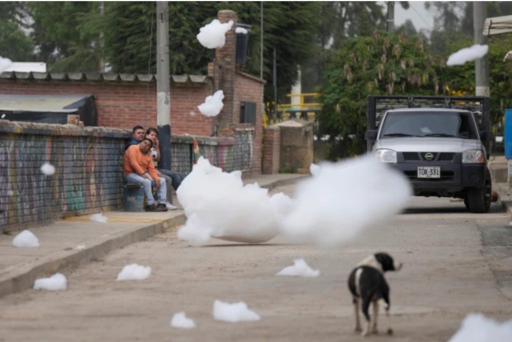 Clouds of toxic foam rising from the Balsillas River float over the Los Puentes neighborhood in Mosquera, Colombia, Wednesday, April 27, 2022