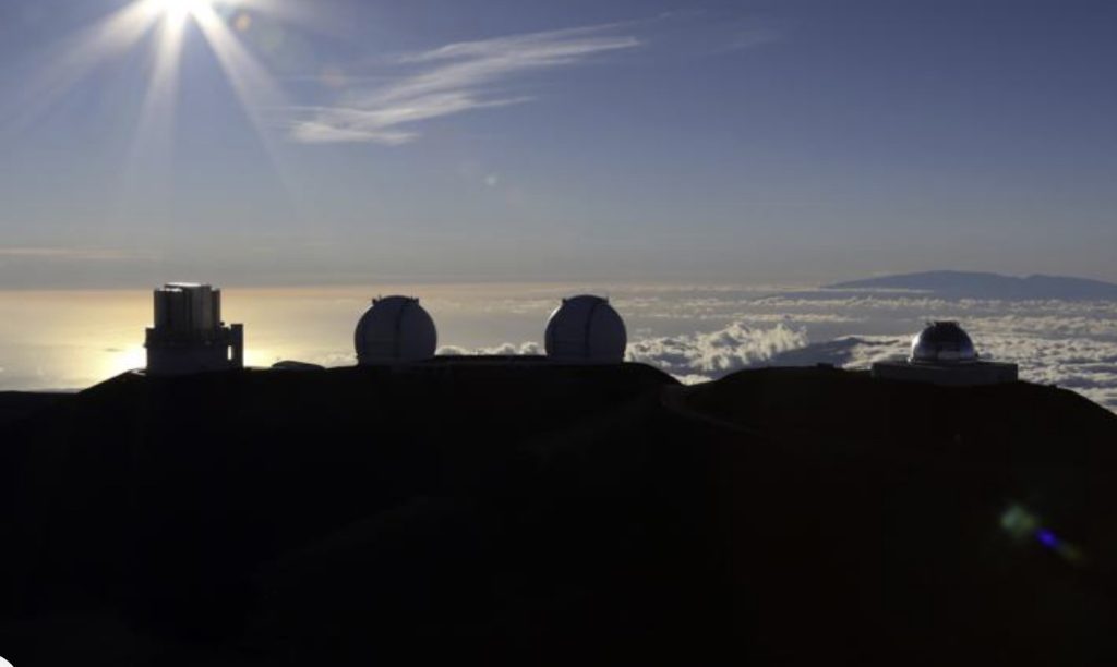 The sun sets behind telescopes on July 14, 2019, at the summit of the Big Island's Mauna Kea in Hawaii. For over 50 years, telescopes have dominated the summit of Mauna Kea, a place sacred to Native Hawaiians and one of the best places in the world to study the night sky. That's now changing with a new state law saying Mauna Kea must be protected for future generations and that science must be balanced with culture and the environment.