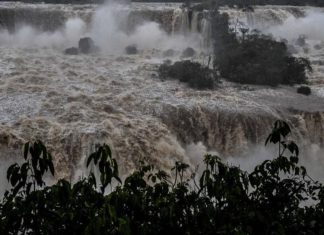 Iguazu, among the world's biggest waterfalls, has nearly 10 times the usual water volume after heavy rains in southern Brazil.