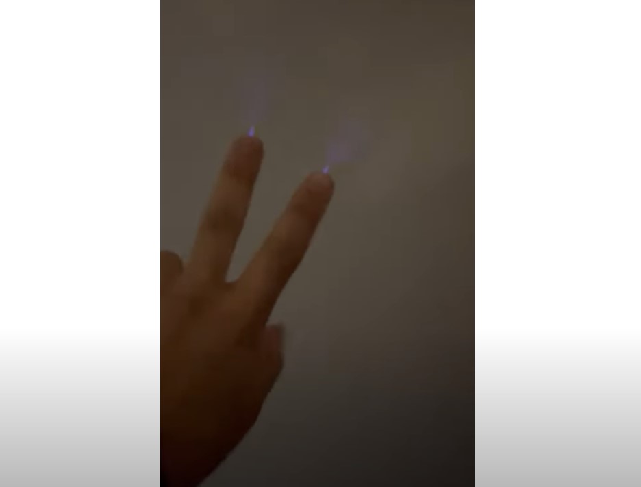 Mysterious glow on fingers during thunderstorms in Saudi Arabia. Picture via Youtube video